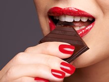 Lady tasting chocolate